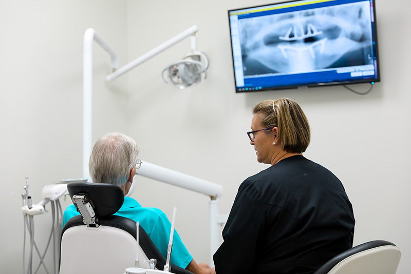 A patient having a dental implant consultation