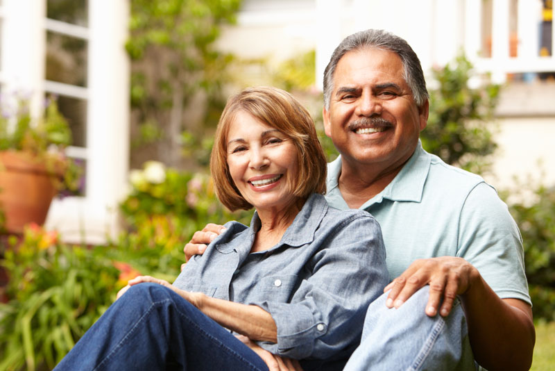 Dental Implant and Denture Patients Smiling Together